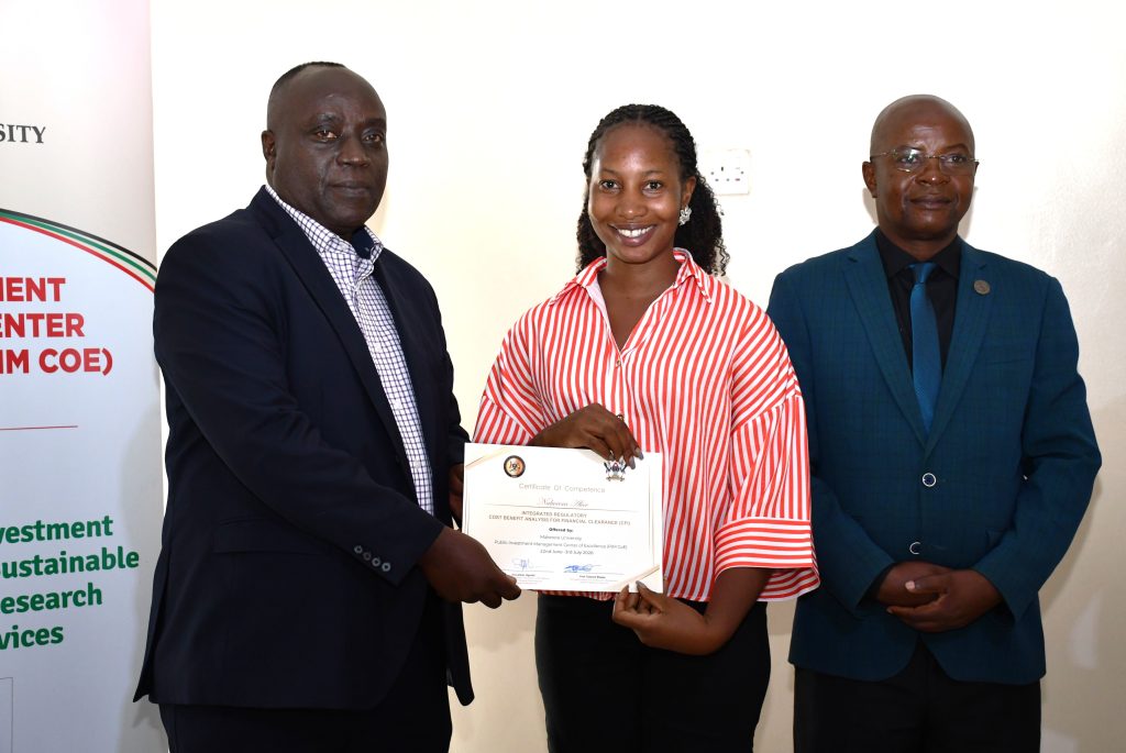 Commissioner Henry Mwanja (Left), Trainee (center), and Prof Bbaale (Right)